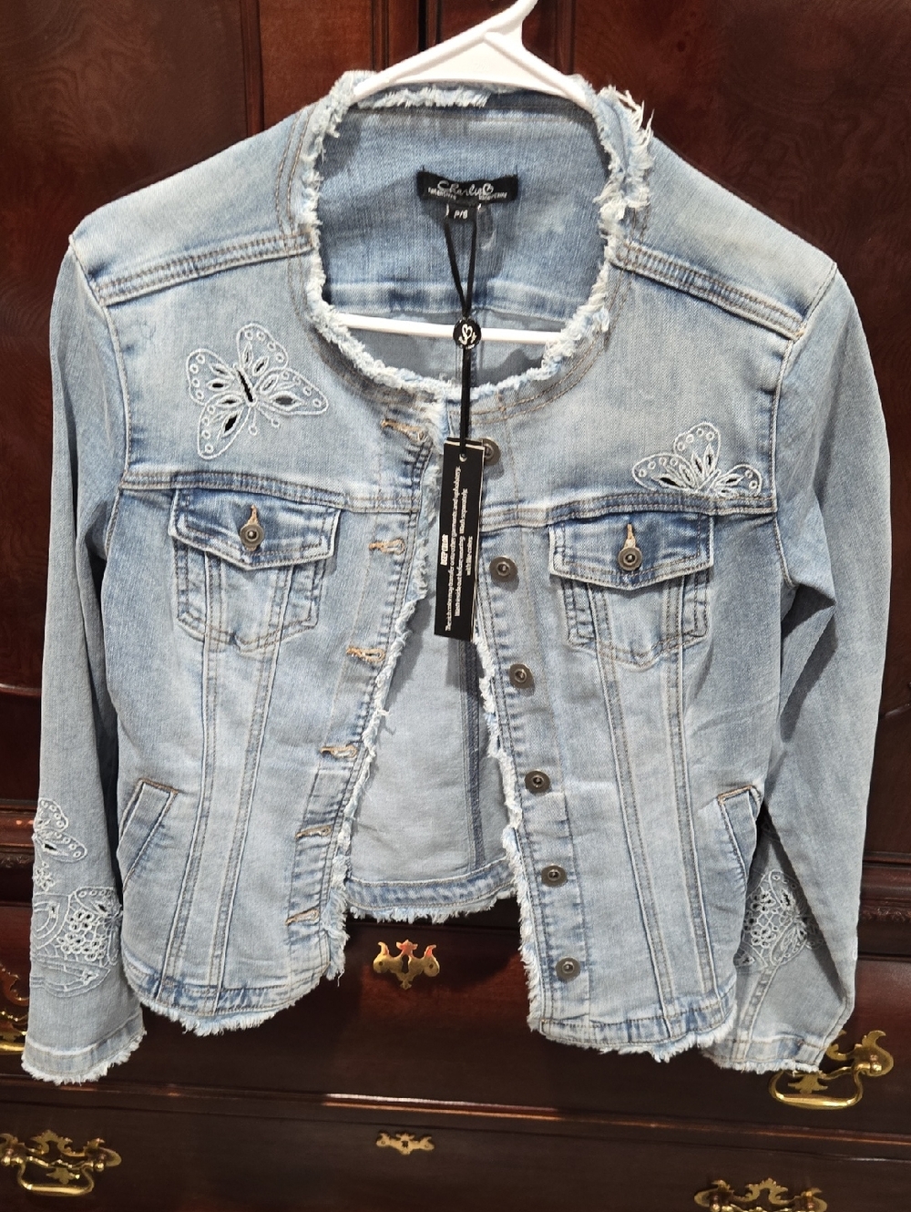 Charlies Light Blue Distressed Denim Jacket with Red Accent Nails